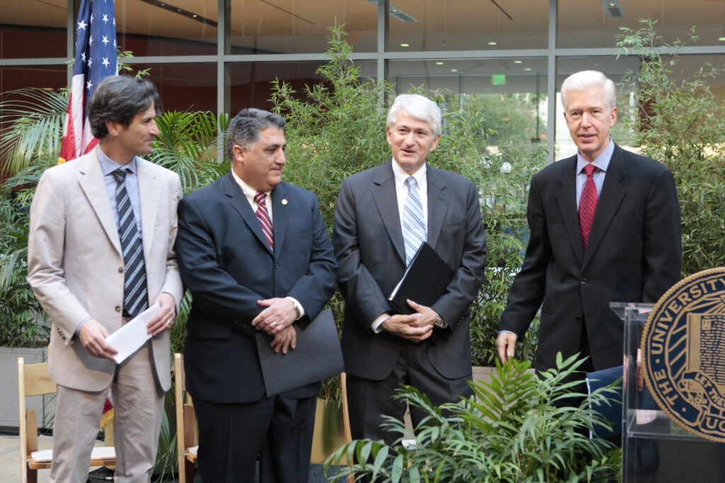 Chancellor Block and attendees pose for a photo at the CNSI (California NanoSystems Institute) grand opening in 2007.