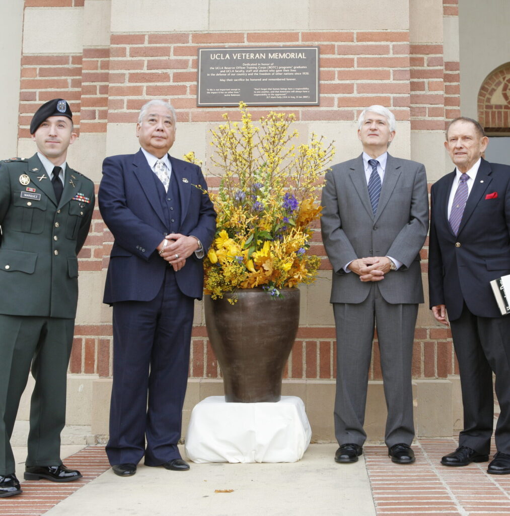 Chancellor Block and attendees pose for a photo at the 2007 Veterans Day Event.