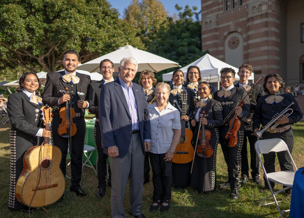 Chancellor Block and Carol Block pose with Mariachi de Uclatlán, a student group dedicated to the performance of traditional Mexican music.