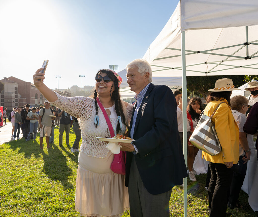 Chancellor Block takes a selfie with a guest at the UCLA Latinx Welcome event, designed to foster community for Latino students.