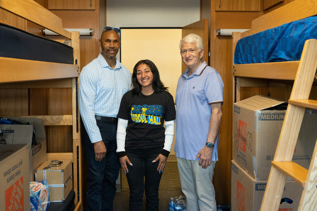 A Sproul Hall staffer shows boxes of supplies for move-in days to Executive Vice Chancellor Darnell Hunt and Chancellor Block. 