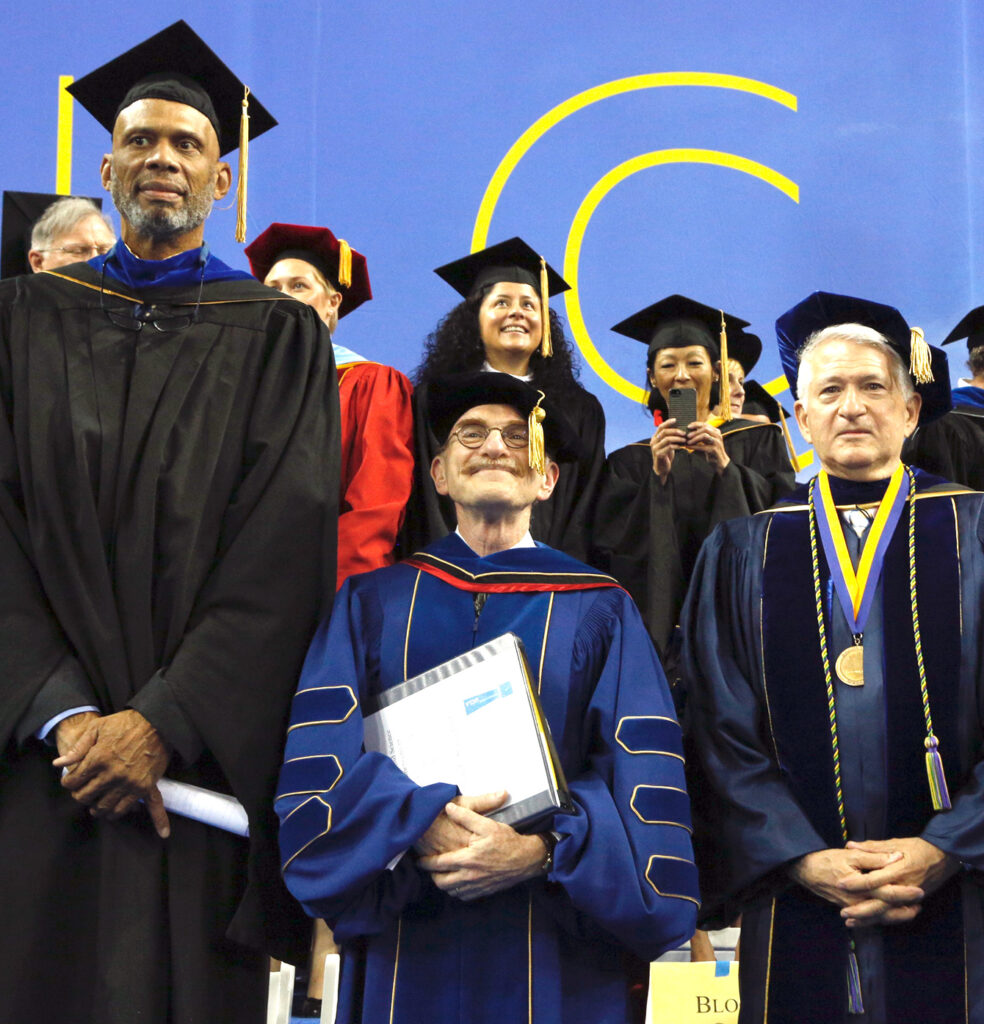 Chancellor Block onstage with Nobel Prize winner Dr. Randy Schekman and Kareem Abdul-Jabbar at the 2014 UCLA Commencement