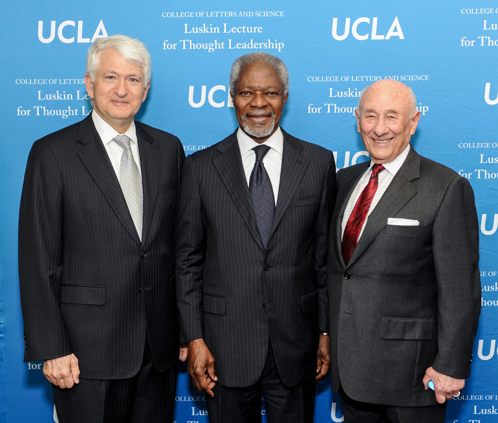 Chancellor Block poses with Gen. Kofi Annan and Meyer Luskin in 2013.